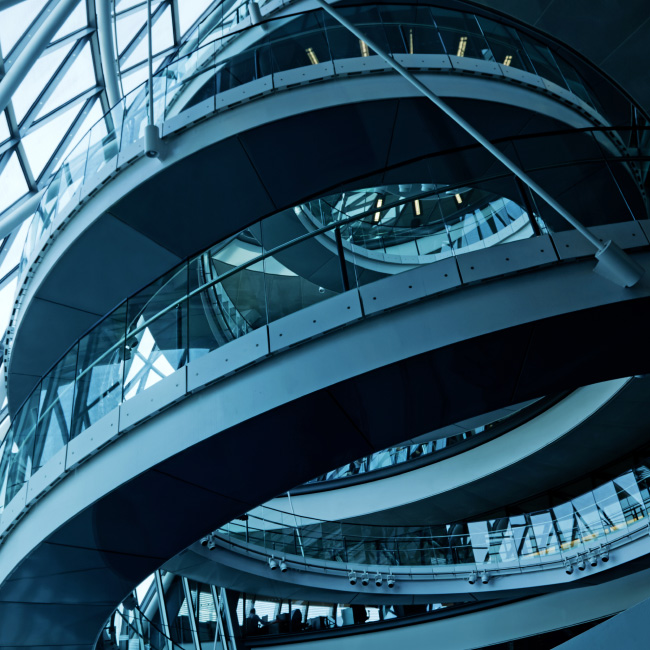 A spiral staircase gracefully winding within a building, offering a captivating architectural element.